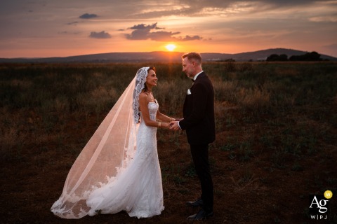 At Domaine des Moures In Montpellier, A Couple’s Portrait Against Glowing Sunset Colors Enriches The Romantic Wedding Atmosphere At Domaine des Moures in Montpellier, a couple’s portrait is set against a glowing sunset, with warm colors enriching the romantic atmosphere.