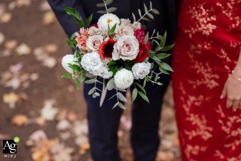 Chinese Bride and Groom Showcase Bouquet Details at Parc Molson in Montreal Quebec Parc Molson in Montreal, Quebec, serves as the setting where a Chinese bride and groom center their portrait session around the bouquet details, highlighting its significance in their wedding photographs.