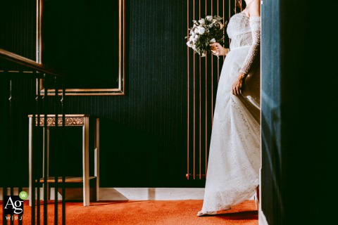 Bride’s Bouquet and Shoes Are Highlighted at Le Prince Noir in Lot et Garonne France Inside le Prince Noir in Lot-et-Garonne, France, a close-up highlights the bride’s bouquet and shoes, focusing on personal details before the festivities.