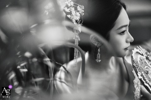 Royal Tulip Zhujiajiao In Shanghai Presents A Black-And-White Bride Portrait With Foreground Plants For Texture And Artistic Mood Royal Tulip Zhujiajiao in Shanghai presents a delicate black-and-white portrait of the bride, with plants in the foreground adding texture and artistic mood to the composition.