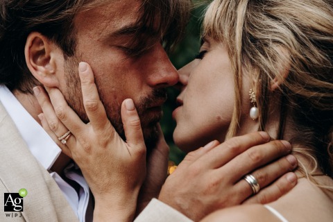 A Simple Kiss and Connection Displayed During the Day’s Events at Château de Dangy in Indre At Château de Dangy in Indre, the couple shares a kiss, a straightforward display of affection and connection during the day’s events.