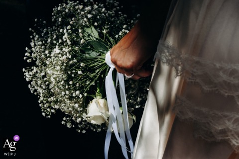 Inside Chateau De Dangy In Indre, A Close-Up Of The Bride’s Bouquet Presents Classic Blooms And Fresh Greenery For Detail Inside Chateau de Dangy in Indre, a close-up features the bride’s bouquet, the arrangement’s fresh blooms and greenery providing a classic wedding day detail.