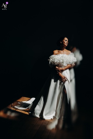 At The Chateau In Gers, A Portrait Showcases The Bride’s Pose And Expression Against The Historic Castle Surroundings At the Château in Gers, a portrait showcases the bride, her pose and expression reflecting the elegance of the castle’s historic surroundings.