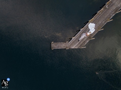 Sweeping View Above Lake Of Zoug In Switzerland Captures The Couple Together, Titled From Above With Love For Scenic Beauty Above Lake of Zoug in Switzerland, a sweeping view captures the couple together, the perspective titled “From Above with Love” highlighting their connection amidst scenic beauty.