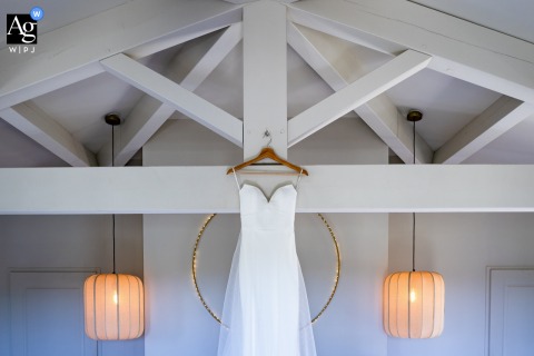 At Les Domaines De Patras In Solérieux, France, A Beautifully Draped Wedding Dress Showcases Luxurious Fabric In Graceful Layers At Les Domaines de Patras in Solérieux, Drome, France, a beautifully draped wedding dress is showcased, the luxurious fabric falling in graceful layers.