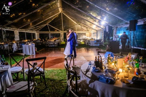 The Bride And Groom Share Their Last Private Dance Inside The Party Tent At The Retreat In Sarasota, Florida Inside the party tent at The Retreat in Sarasota, Florida, the bride and groom share their last private dance before making their grand exit at the reception.