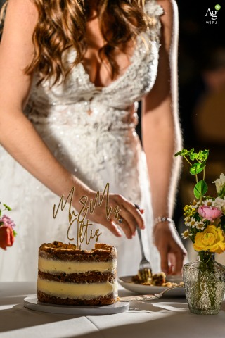 Bride Enjoys Her Wedding Cake During Reception at The Retreat in Sarasota Florida During a reception at The Retreat in Sarasota, Florida, the bride enthusiastically digs into her wedding cake, her highlight of the celebration.