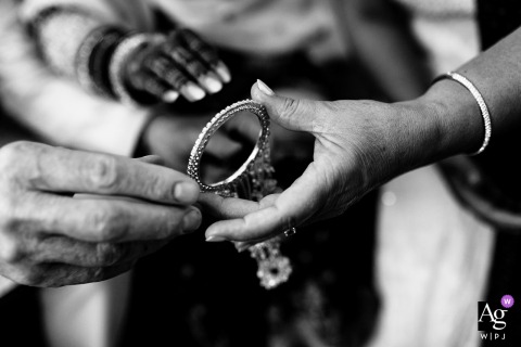 During The Churra Ceremony In Edmonton, Alberta, A Close-Up Highlights The Bride’s Hand, Honoring Wedding Tradition And Detail During the Churra ceremony at home in Edmonton, Alberta, a close-up highlights the bride’s hand, honoring tradition and celebratory detail.