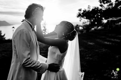 Couple Poses for BW Portrait in the Lush Garden at Victoria Hotel in Montreux Switzerland In the lush hotel garden at Victoria Hotel in Montreux, Switzerland, the bride and groom pose, surrounded by serene trees and elegant floral pathways.