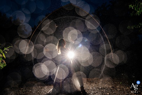 Outside The Zuid Holland Wedding Location, Rain And Light Blend Creatively To Shape A Unique And Striking Scene Just outside the wedding location in Zuid Holland, natural light and rain combine to create a unique atmosphere, blending weather and illumination in a striking wedding scene.