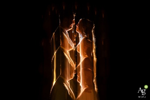 Reflections of the Couple Overlap in a Lively Narrative Portrait Scene at Zuid Holland Wedding Location Within the wedding location in Zuid Holland, the couple shares a trice reflected scene in unison, their interactions overlapping to create a lively, layered narrative of connection and celebration.