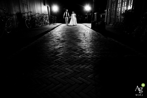 A Couple Discovers City Nights Walking Down a Quiet Lane at Night in Leiden Strolling down a quiet lane at night in Leiden, a couple discovers the city’s magic under glowing streetlights, their walk infused with a sense of wonder and connection.