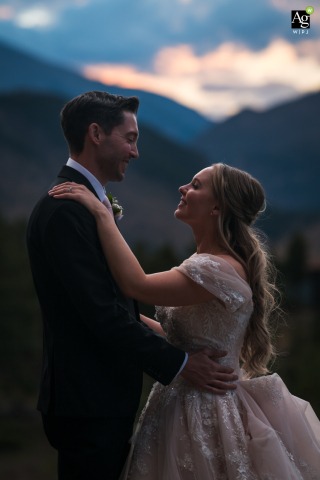 Soft Mountain Light Bathes Embracing Couple at YMCA of the Rockies in Estes Park Colorado At YMCA of the Rockies in Estes Park, Colorado, a couple embraces in the fading mountain light, surrounded by peaceful alpine vistas and the soft glow of dusk.