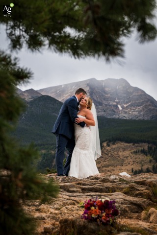 Couple Escapes Into Rocky Mountain National Park Estes Park For Peaceful Portrait Session With A View Before their ceremony, the couple slips away into Rocky Mountain National Park, Estes Park, Colorado for a peaceful escape portrait session, surrounded by wild natural beauty and mountain vistas.