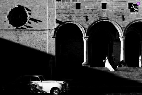   Outside the church in Osimo, the newlyweds are surrounded by stunning light, the scene bathed in contrast that emphasizes the joy and importance of the day.