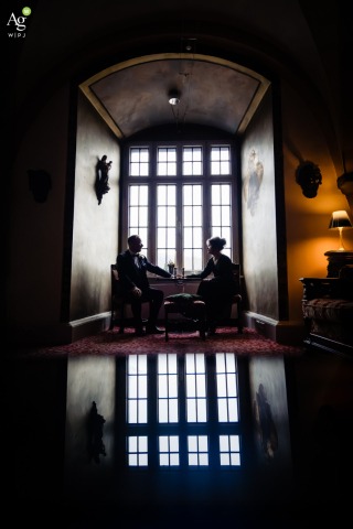 Laughter And Conversation Unfold Within Walls Of Schloss Westerburg Westerburg Castle Within the historic walls of Schloss Westerburg, Westerburg, candid laughter and quiet conversation unfold, as the castle setting adds charm to the scene.