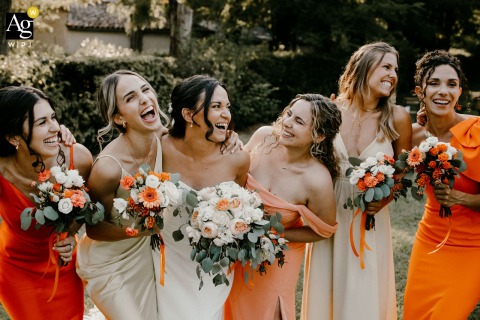   Laughter and camaraderie fill the scene at Château de Granoupiac, where the bride enjoys a joyful time with her bridesmaids among the venue’s historic settings.