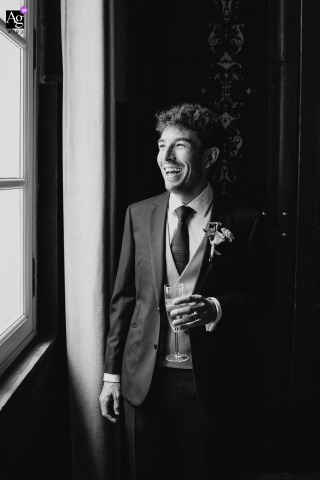 Black And White Portrait Of The Groom At Château de Pondres Emphasizes Classic Style Within Refined Castle Architecture At Château de Pondres, a black and white portrait captures the groom, emphasizing classic elegance and timeless style within the castle’s refined architecture.