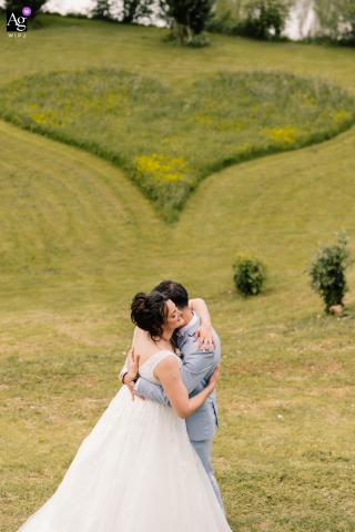 Joyful Couple Smiles Together In The Lush Garden Of The Reception Venue, Greenery And Atmosphere Complementing Their Happiness An inviting garden at the reception venue provides the setting for the couple’s portrait, the lush greenery and relaxed atmosphere highlighting their happiness on the day.