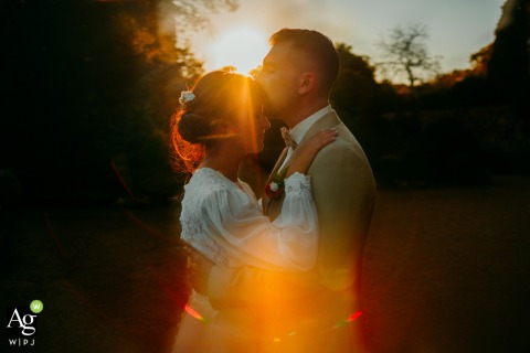 Sunset Romance Bathes Couple In Warm Light At Château Bas d’Aumelas France A gentle and tender scene unfolds at sunset at Château Bas d'Aumelas, where soft light bathes the couple in a romantic and warm outdoor atmosphere.
