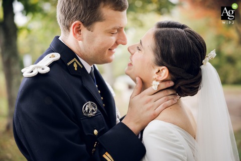Bride And Groom Share Tender Gaze Outdoors, Their Affection Glows In Nature Out in nature, the bride and groom share a tender gaze and heartfelt smiles, their genuine affection glowing in this intimate portrait.