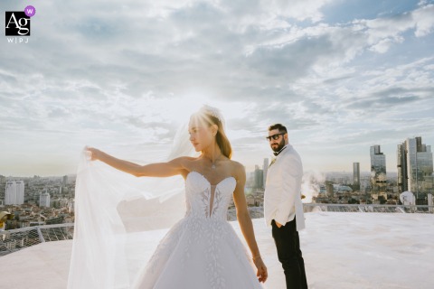On The Rooftop Of Point Hotel Istanbul, The Couple Poses Together With The Dramatic Urban Skyline As Backdrop On the rooftop of Point Hotel Istanbul, the couple enjoys the city views, the urban skyline serving as a dramatic stage for their portrait.