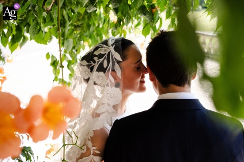 Couple Shares Tender Portrait Amid Serene Grounds At Domaine Des Croisettes Isère At Domaine des Croisettes en Isère, the couple share a tender portrait, their gentle embrace framed by the serene grounds of the venue.