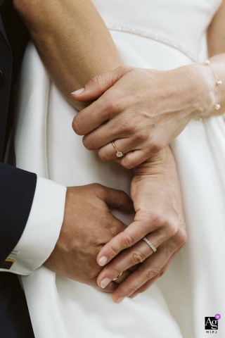 Close-Up Of Couple’s Hands And Rings At Stift Wilhering Austria At Stift Wilhering in Austria, an elegant close-up highlights the couple’s hands and wedding rings, emphasizing the meaningful details of their union.