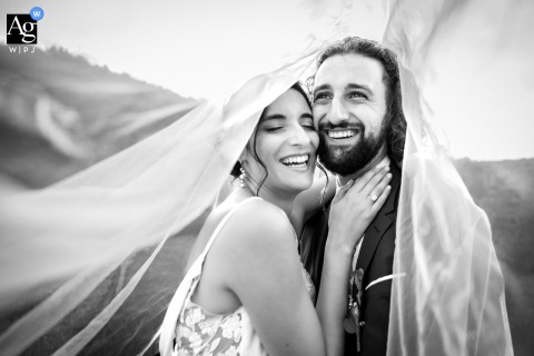 Couple Quietly Framed Beneath Delicate Veil At Château De Bussy Rabutin Bourgogne At Château de Bussy Rabutin in Bourgogne-Franche-Comté, the couple is quietly framed together beneath a delicate wedding veil, evoking a sense of intimacy and romance.