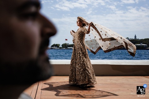 Bride’s Portrait Framed Through Groom’s Silhouette At The Peninsula Istanbul Hotel At The Peninsula Istanbul Hotel, the bride’s portrait is creatively composed through the groom’s silhouetted profile, blending elegance with visual intrigue in the luxurious hotel setting.