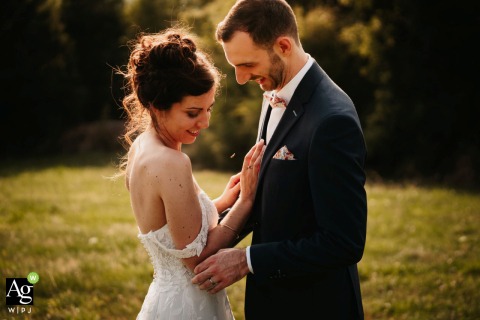 Gentle Affection Shared Between Couple in the Fields at Domaine des Monts du Lyonnais, Rhône, France A gentle, affectionate exchange takes place in the fields at Domaine des Monts du Lyonnais in Rhône, the landscape echoing the couple’s soft intimacy.