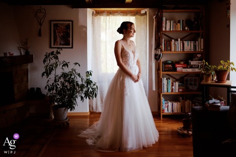 Bride Poses For Classic Wedding Portrait In Warm Intimate Fribourg Home In the comfort of her Fribourg home, the bride poses for a classic wedding portrait, the familiar surroundings offering a sense of warmth and intimacy to the image.