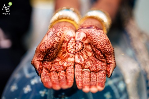 Golden Bangles and Henna Designs Grace Brides Hands at Talamore Country Club in Philadelphia, Pennsylvania At Talamore Country Club in Philadelphia, vibrant henna designs and golden bangles adorn the brides graceful hands, poised for the beginning of a bright, shared future.