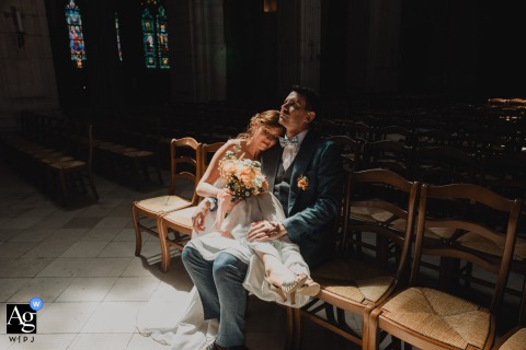 Reflective Portrait Of The Married Couple In Soft Light At A l'Eglise After the ceremony, the married couple pauses in the soft, natural light inside the church, creating a peaceful and reflective portrait at A l'Eglise.