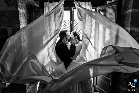 Elegant Couple Posed At The Opulent Hotel Palacio De Úbeda In Spain The couple is elegantly posed at Hotel Palacio de Úbeda GL in Úbeda, Jaén, Spain, with the grandeur of this luxurious hotel providing an opulent backdrop for their portrait.