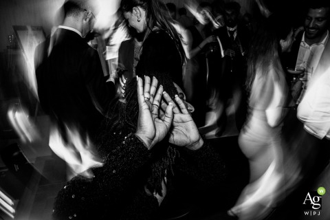 Laughter, Music, and Motion Blurred Hands Fill the Celebration at a Birmingham, UK, Family Home Joined hands sway gracefully in the midst of a celebration at a private house in Birmingham, UK, as music and laughter fill the bustling family home.