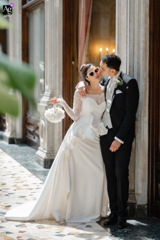 Historic Elegance Surrounds The Couple At Galleria Subalpina In Turin, Italy During Their Portrait At Galleria Subalpina in Turin, Italy, the couple share an elegant couple portrait beneath the gallery's historic architecture, creating a timeless image that blends their connection with the beauty of the city center.