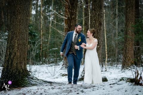 At a forest photoshoot location in Amersfoort, Utrecht, the bride and groom share a winter portrait session surrounded by bare trees, creating a peaceful image that highlights both the season and their connection.