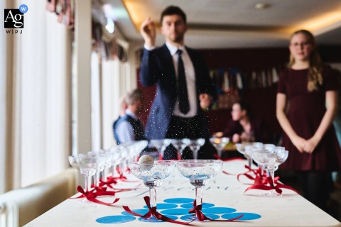 At the reception in Amsterdam, Noord Holland, Netherlands, a detail photograph captures guests playing beer pong, highlighting the playful energy and relaxed spirit of the wedding celebration.