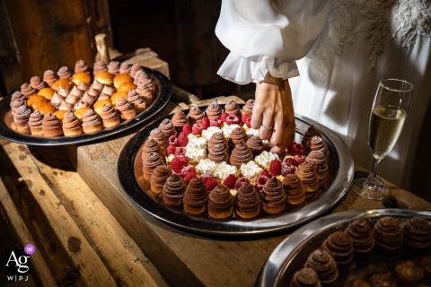 At Hôtel Les Grands Montets in Chamonix, France, the bride takes her share of dessert, adding a playful and relaxed moment to the wedding celebration.