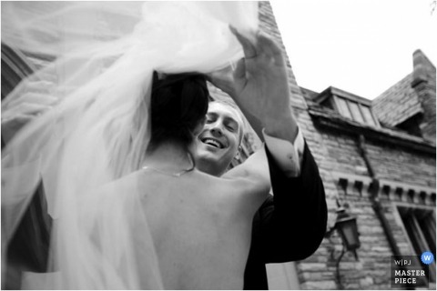 The Missouri groom tenderly pulled back his bride's veil outdoors, creating a beautiful black and white image to capture the scene