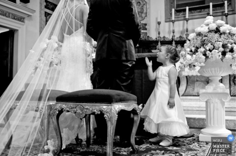 Italy Documentary Wedding Photographer | Image contains: bride groom altar flowergirl ceremony black white