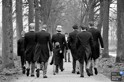 Zuid Holland Wedding Photography - NL | Image contains: groom groomsmen ring bearer walking trees tuxes tails