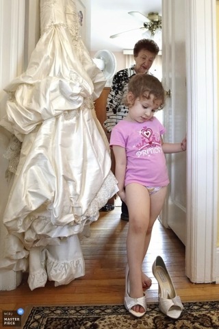 New York City - Metro Wedding Photography | Image contains: girl bride's shoes dress playing