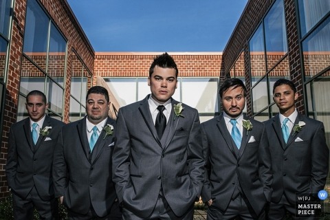 Photo by: <a href="https://www.wpja.com/contests/2014-q1-photography-contest/lit-portrait/1411331">Walter van Dusen - East Lyme Connecticut Connecticut Wedding Photographer | Image contains: groom, groomsmen, windows, sky, outdoors, tuxedo, portrait