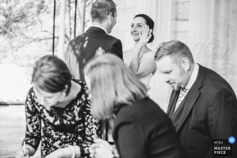 New South Wales Wedding Photojournalism | Image contains:black and white, bride, groom, reception, wedding guests, ring