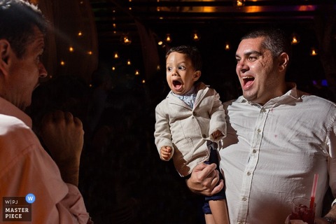Rio de Janeiro guest and boy enjoying the reception - Brazil wedding photojournalism