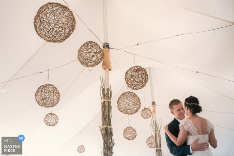 Boston bride and groom dance at the reception in the tent - Massachusetts wedding photojournalism 
