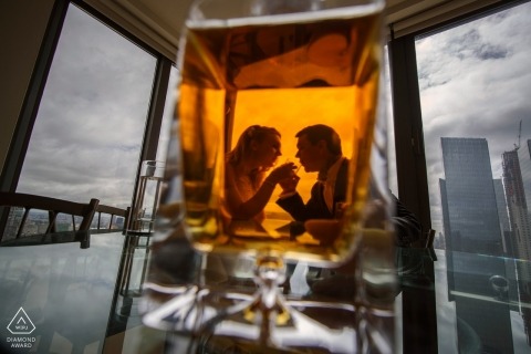 A Bronx engagement photo shoot session of a couple shot through glass and windows | New York  photographer