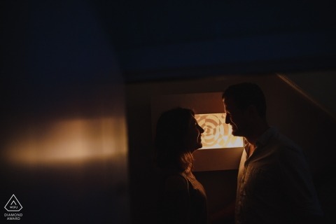 Norfolk Engagement Photographer. Indoor profile silhouette couple portraits in warm light.